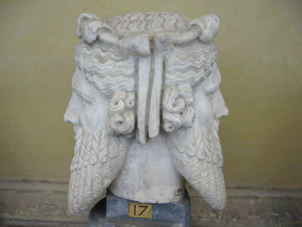 Statue of Janus, the two faced Roman god. Janus was the god of beginnings, gateways, transitions. This is just a lazy visual metaphor for being able to cope with two versions of reality at the same time. 